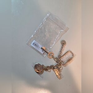 NWT Brahmin Light Gold Lock Clip Charm Key Wagon Logo Accessory Bracelet